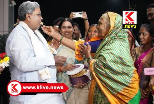 Gruhakshmi Scheme ಗೃಹಲಕ್ಷ್ಮೀ ಯೋಜನೆ ಹಣ ಕೂಡಿಟ್ಟು ಇಡೀ ಹಳ್ಳಿಗೇ ಹೋಳಿಗೆ ಉಣಿಸಿದ ‘ತಾಯಿ’ಗೆ ಸನ್ಮಾನ